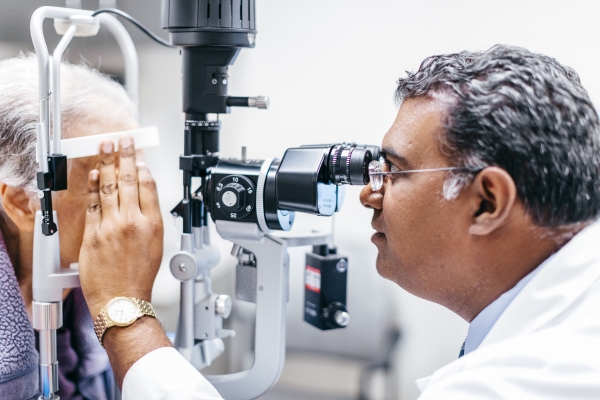 Dr. Mehta completing eye exam