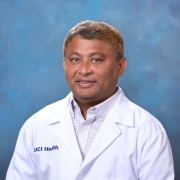 Dr. Gulab Zode in a white coat